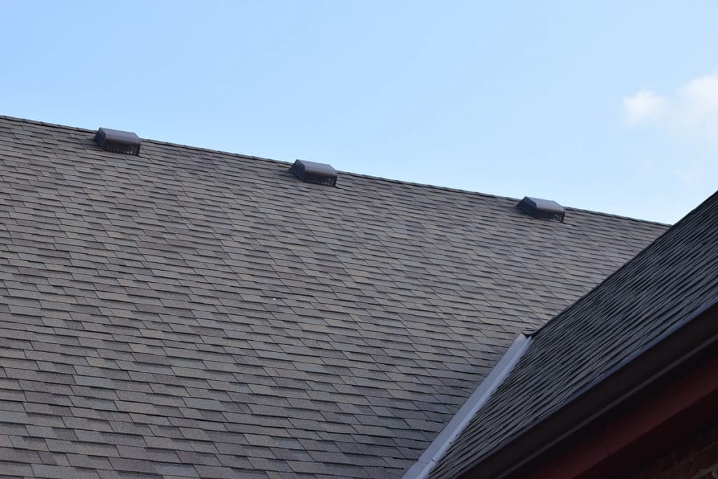 3 roof vents on a shingle roof