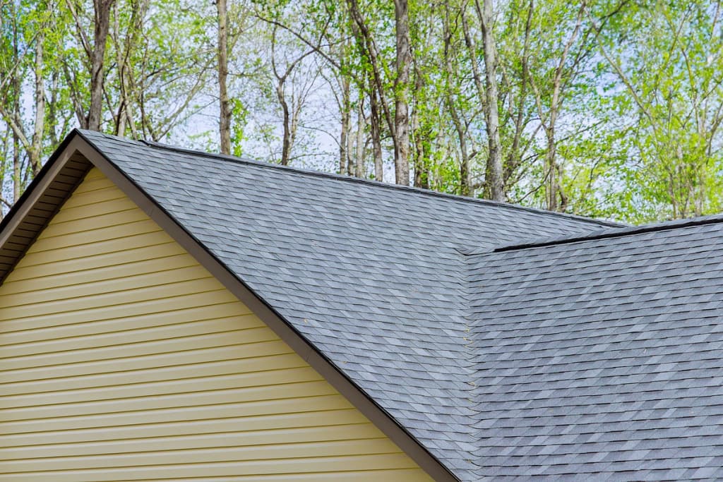 gray shingles and yellow siding