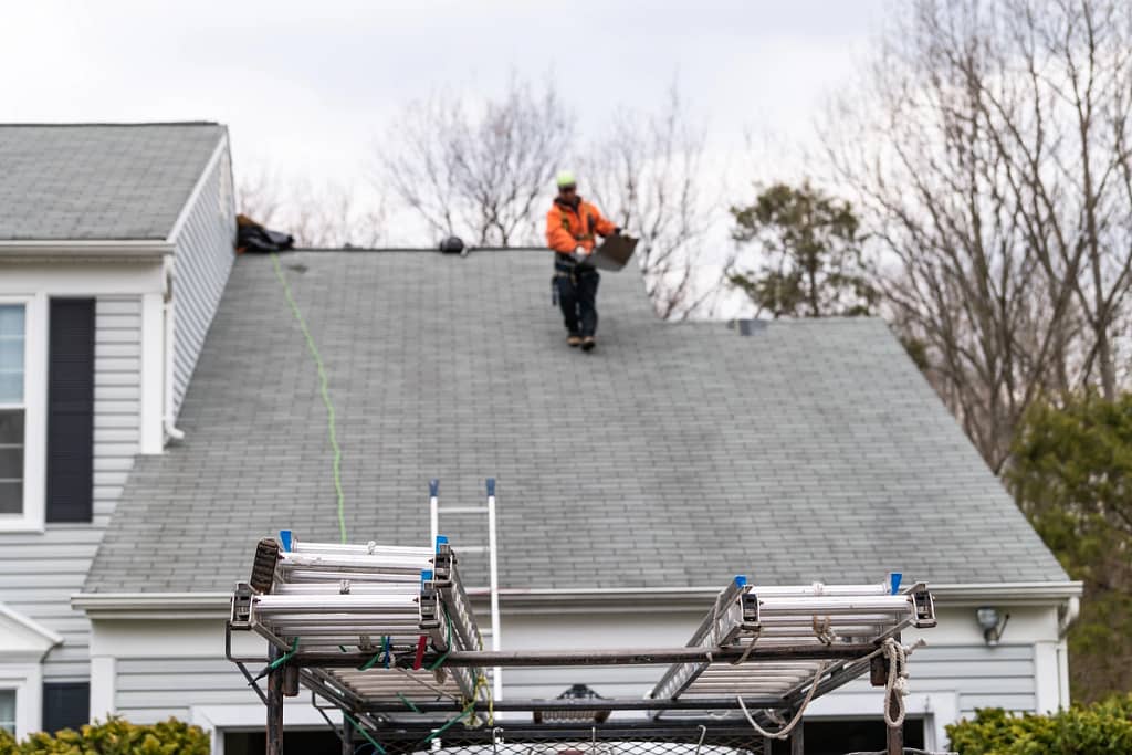 roofer walking on a roof