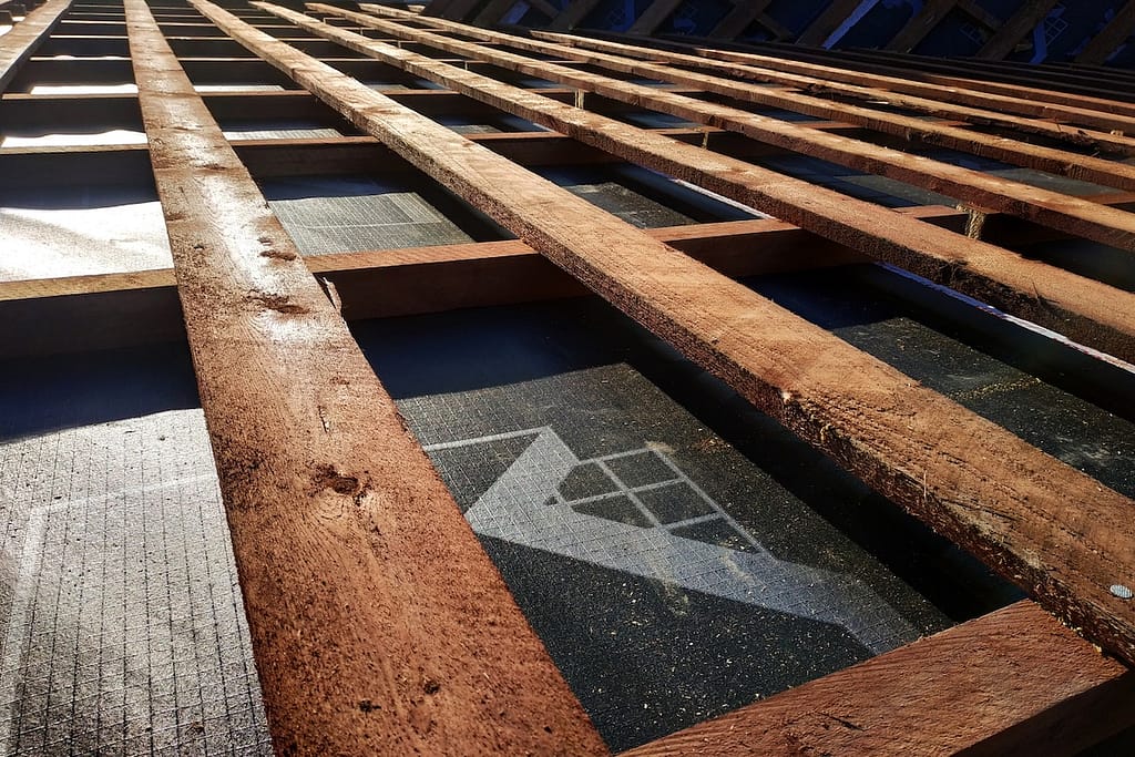 Preparation of roof roof before installation of sheets of metal tiles with insulation, waterproofing with the help of film, boards and bars