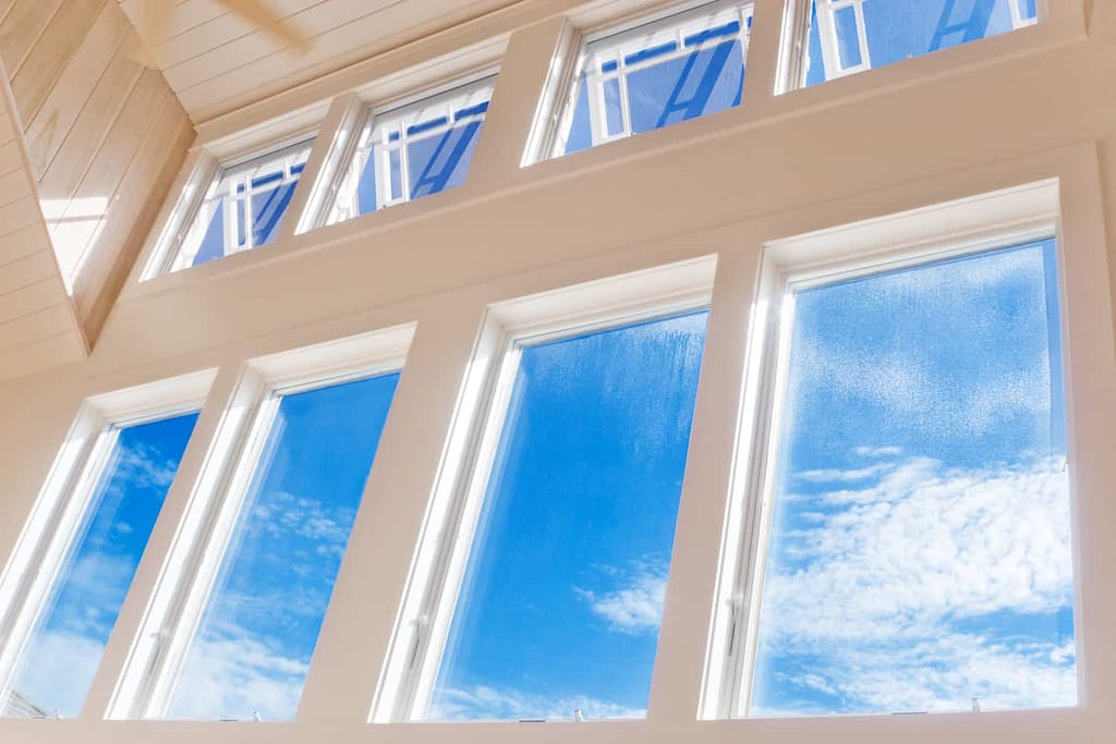 best window brands awning and picture windows in modern home with blue sky
