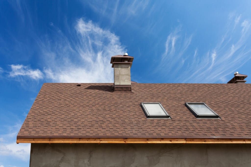 asphalt roofing shingles with a chimney 