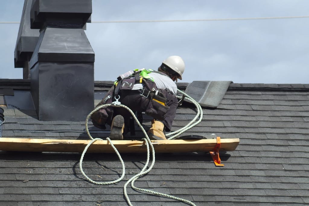 contractor does roof repairs on steep rooftop