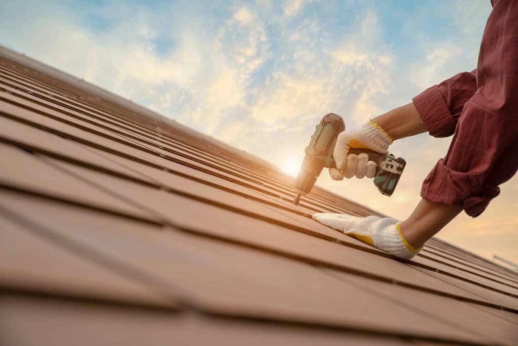 close up to worker using drill