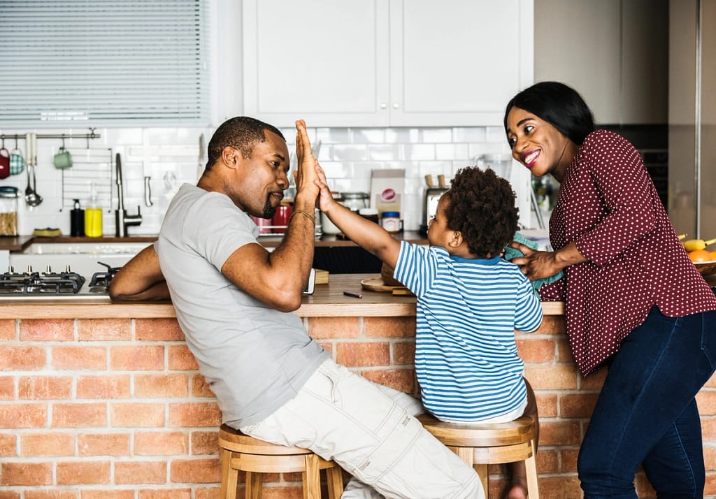 family of three in their kitchen