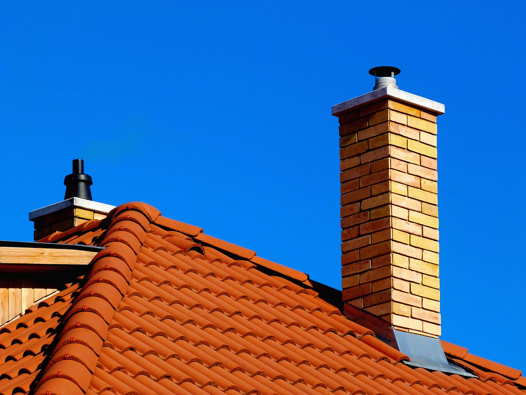 Modern brick finish roof with newly installed chimney flashing
