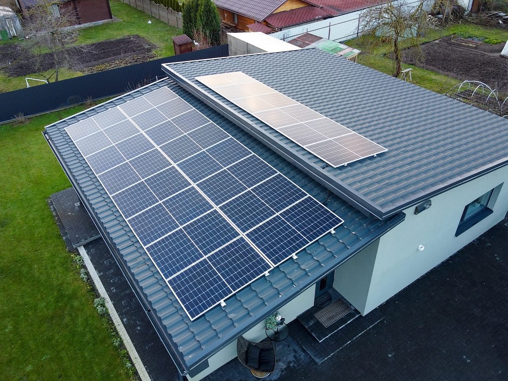 Solar panels on pitched metal roof. 