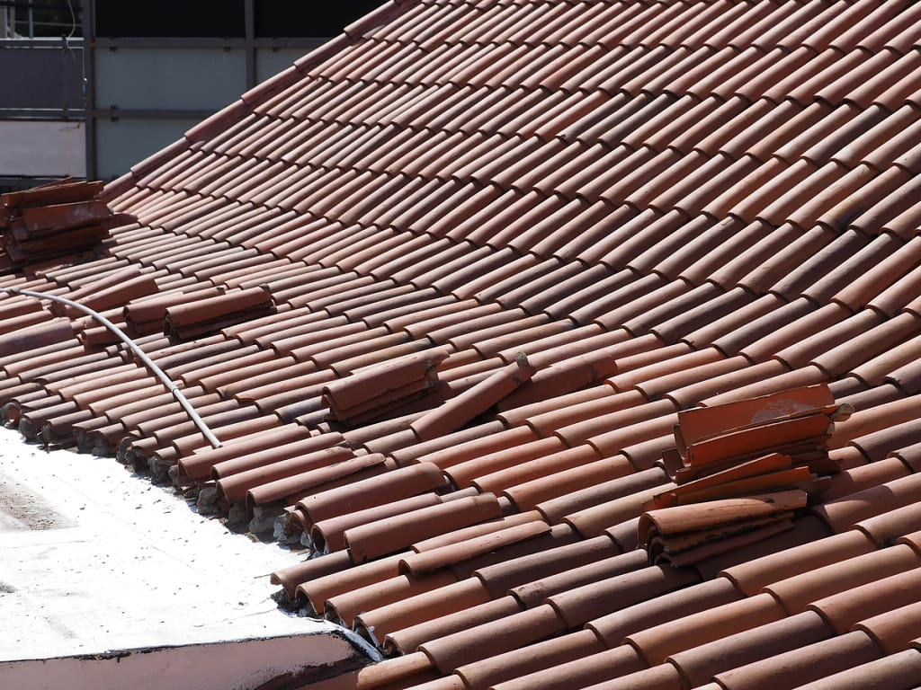 roof tiles being placed in replacement process
