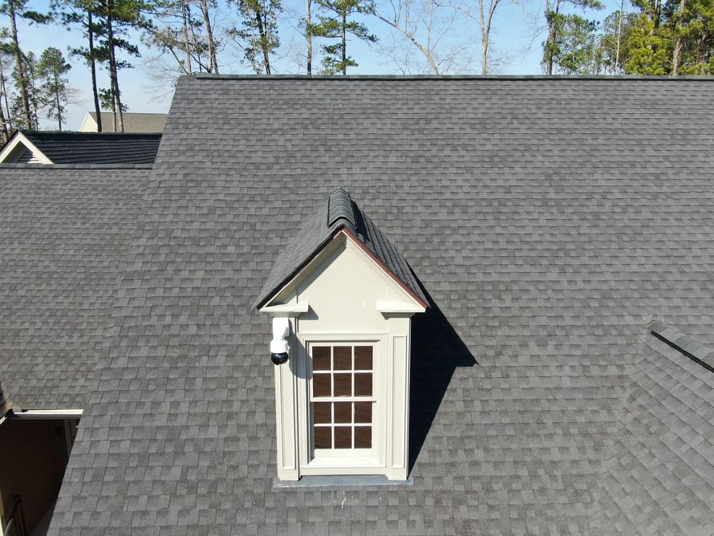 GAF shingles on the neighborhood house roof and window