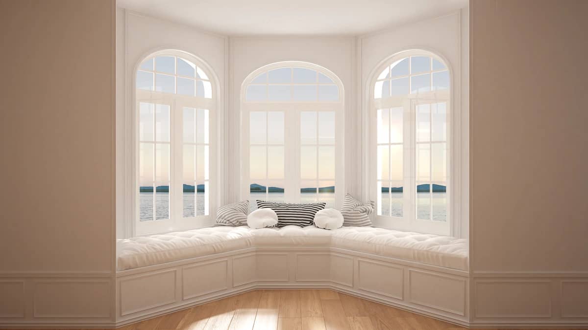 minimalist design with cushions front of bay window