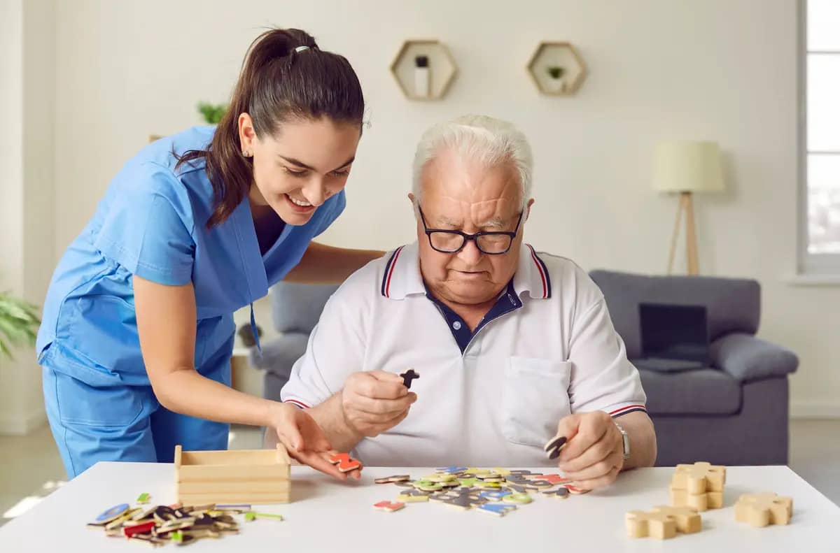 helping older man with puzzle