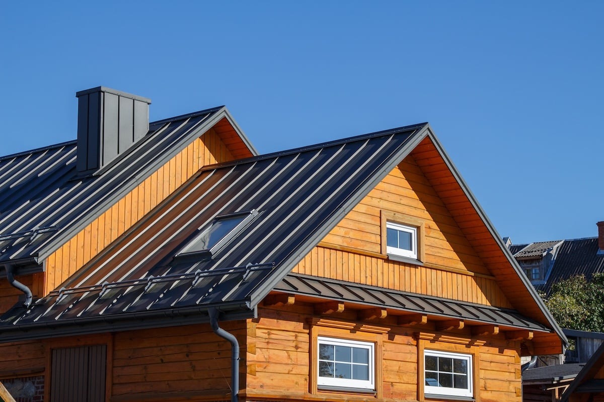 Wooden house with black metal roofing