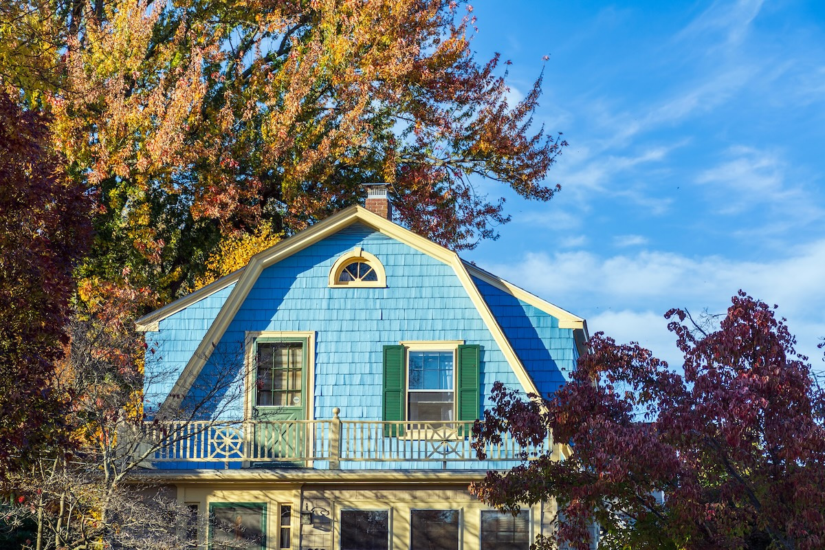 blue house with gambrel roof