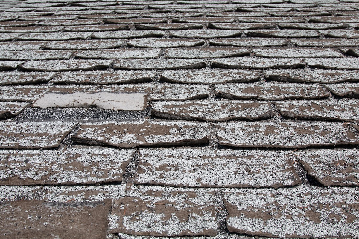 Curling asphalt shingles on roof