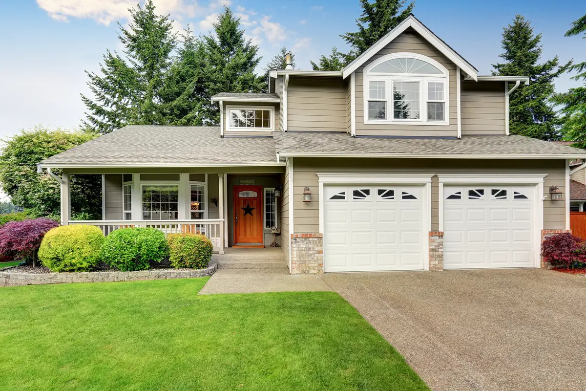 beige colored siding and gray shingles