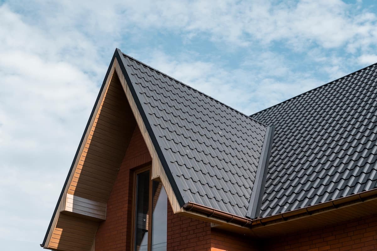 Modern roof covered with tile effect PVC coated brown metal roof sheets
