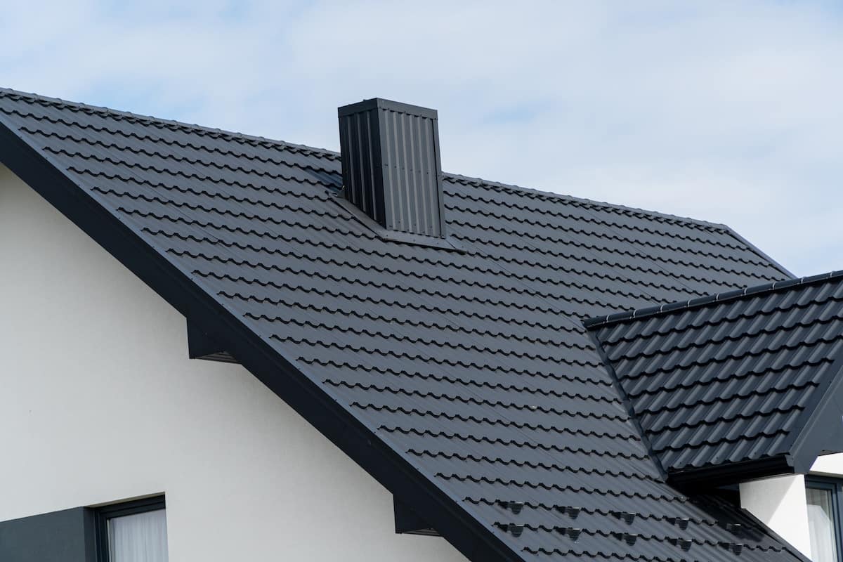 house covered with a modern black metal roof.