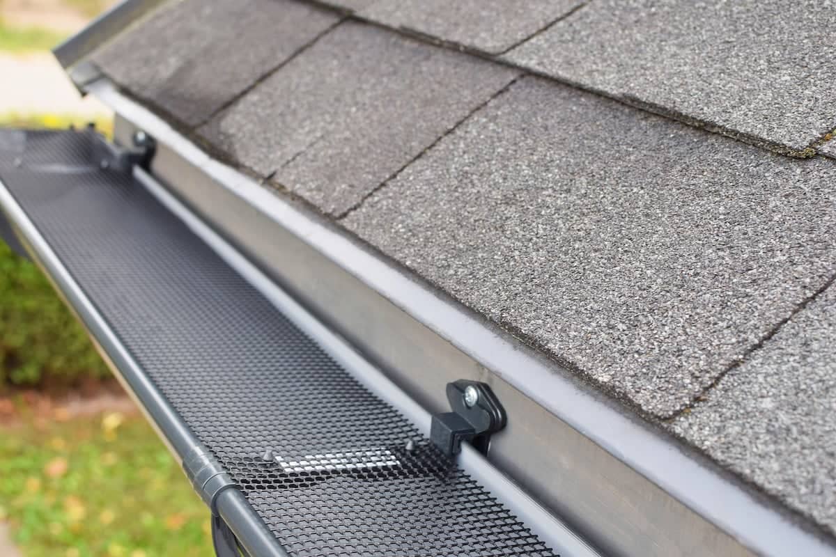 Mesh gutter guard protects gutter from debris