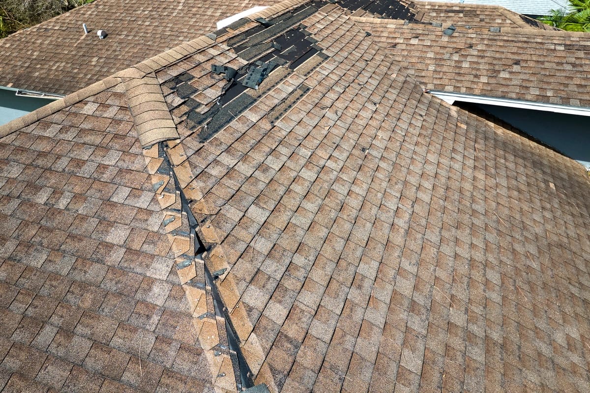 top view of storm damaged roofing shingles