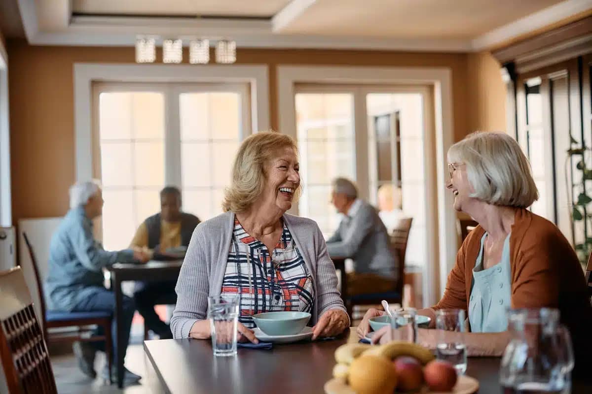 nursing home lunch time happy elderly women