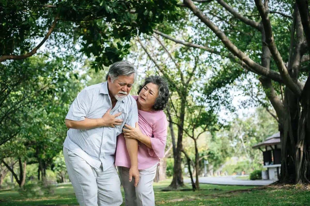 A man has a stroke while his wife looks at him concerned