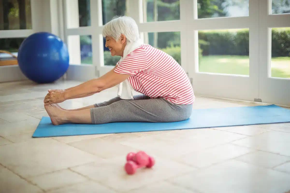 older woman does yoga