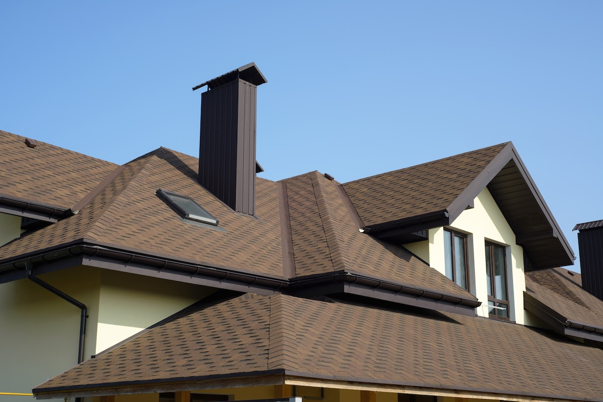 Roof of a new build house with brown asphalt shingles