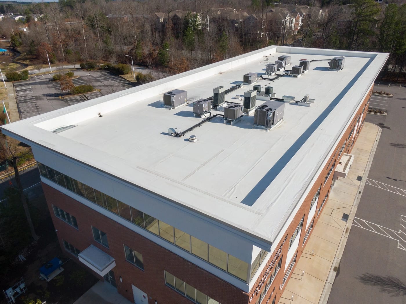 aerial view of new roof coating installed by commercial roofing contractors