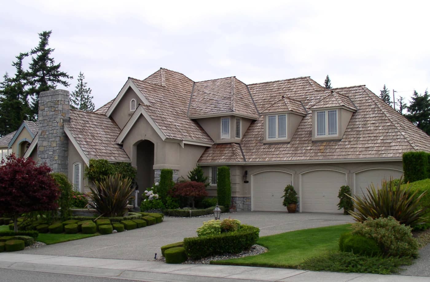 Large residential home in need of cedar shake roof repair