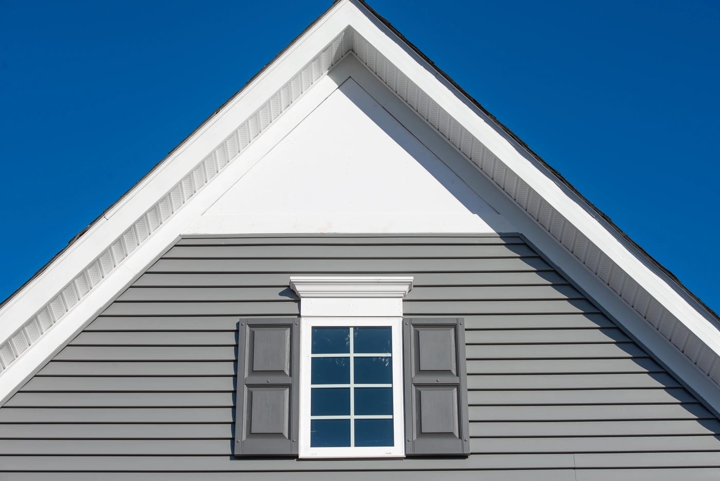 roof gable with window and new grey siding installation in blue bell pa