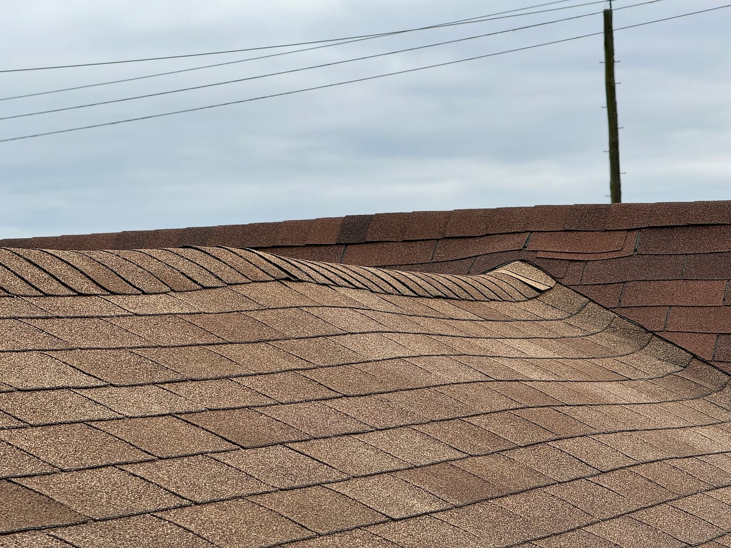 Sagging roof with visible structural damage Roof repair Roof Replacement Roofing Contractor G and Bros Roofing LLC Salisbury MD