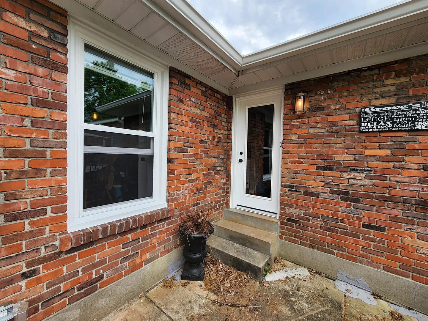 Close up of brick home with new windows