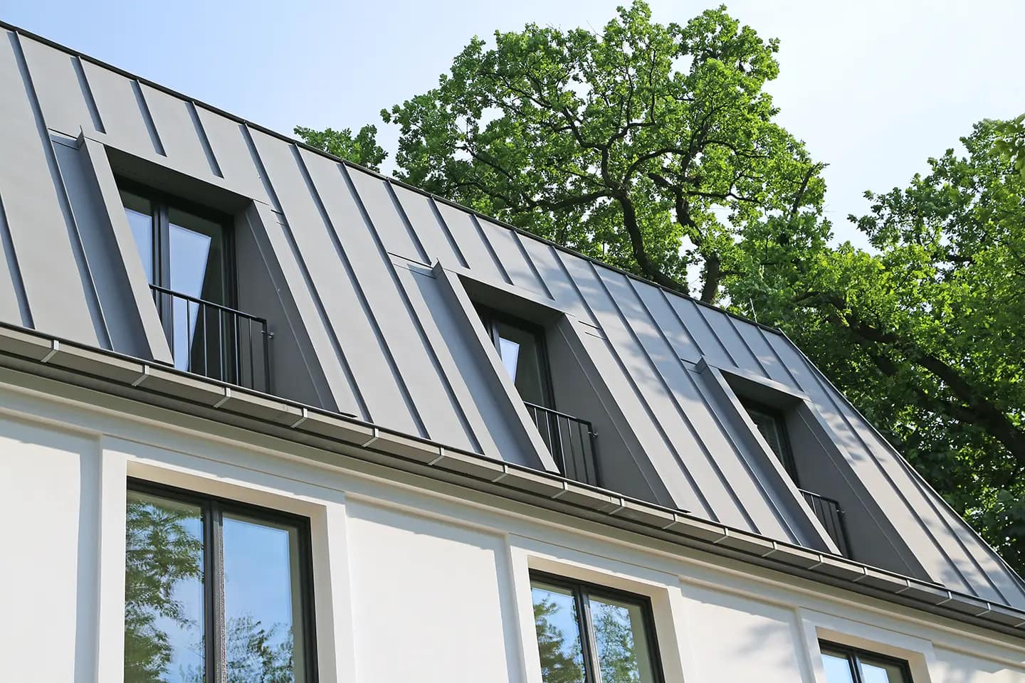 standing seam metal roofing building with gray roof