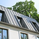 standing seam metal roofing building with gray roof