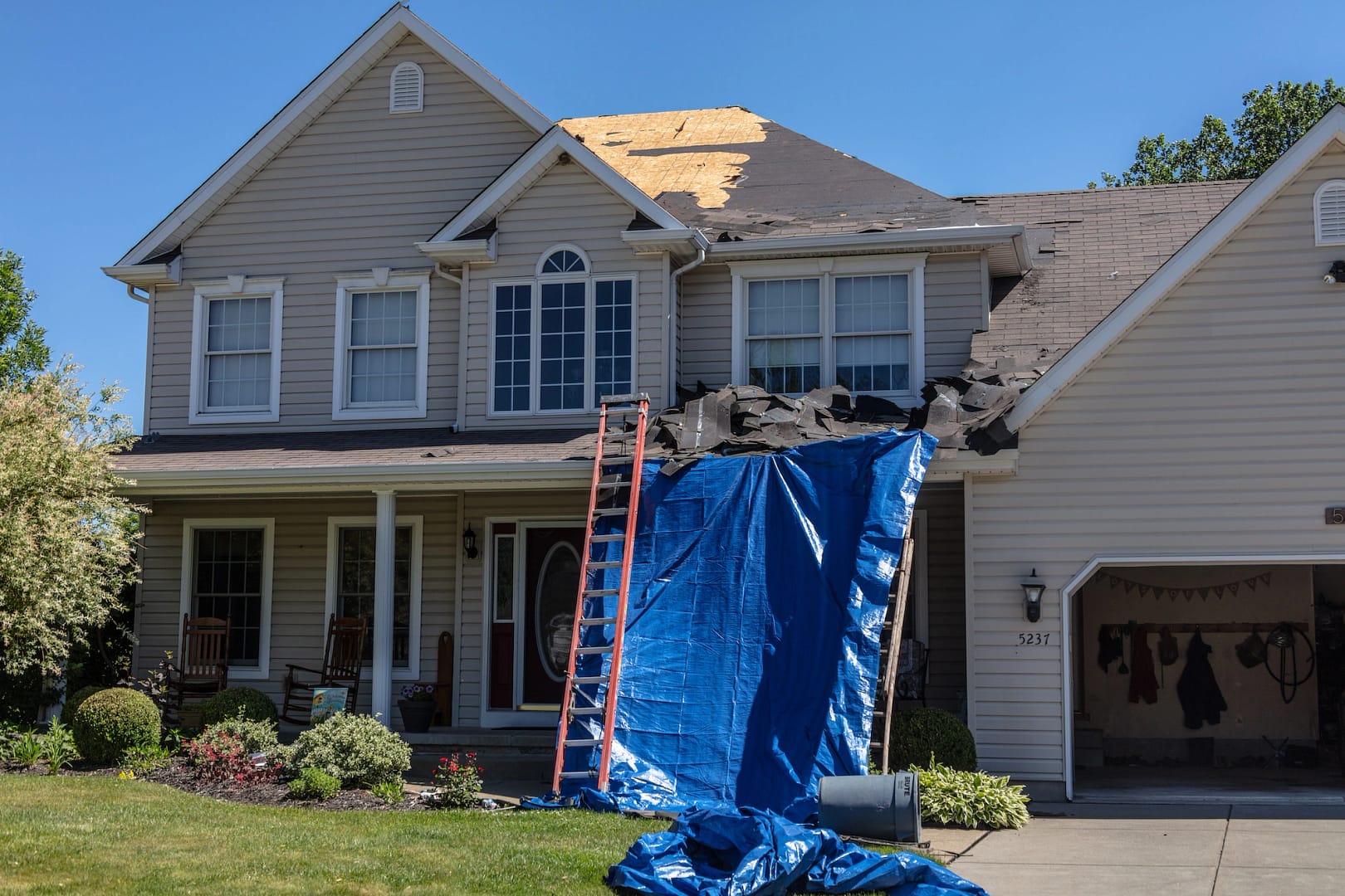 roof repair tarp ladder and tear off