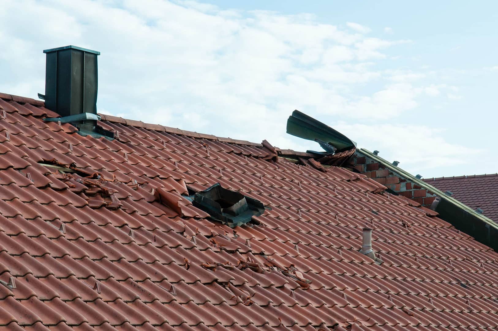 storm damage to clay tile roof