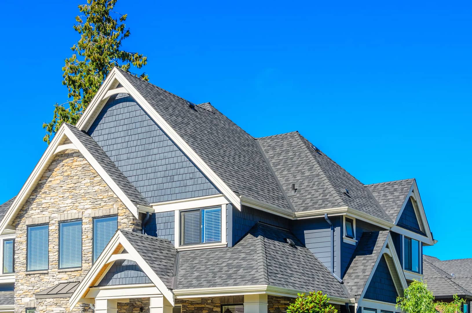 blue house with gray roof