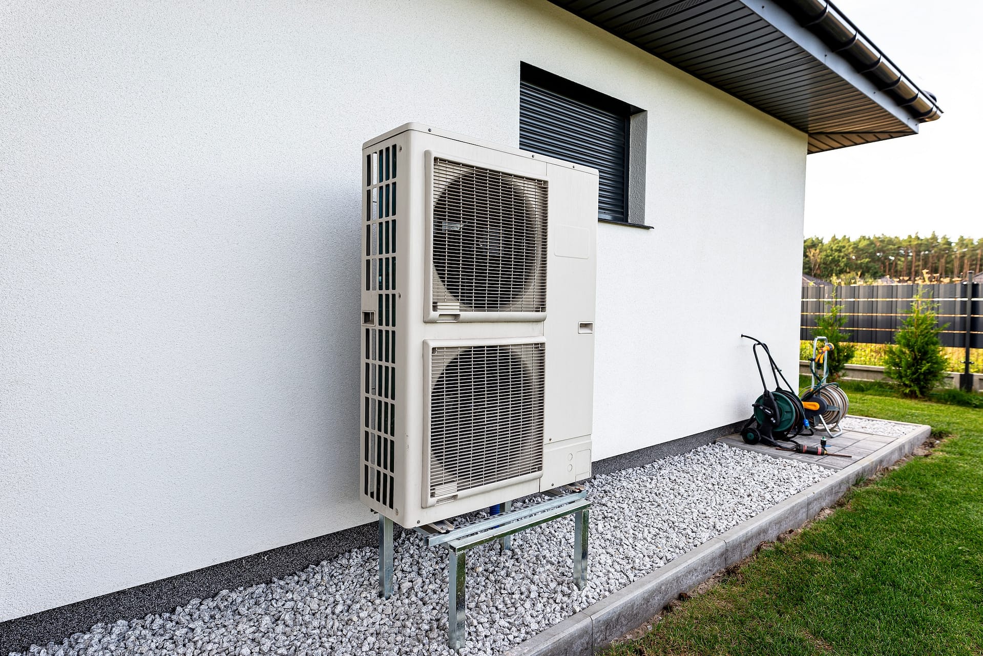 Two efficient outdoor heat pump units placed in front of the house.