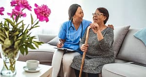 nurse examining elderly woman nurse examining the elderly woman at assisted living facility