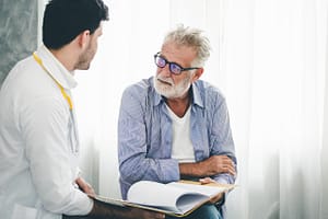 a psychologist discussing behavioral health with a patient