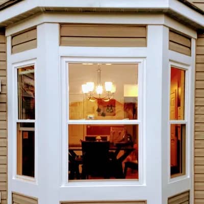 bay window and tan siding