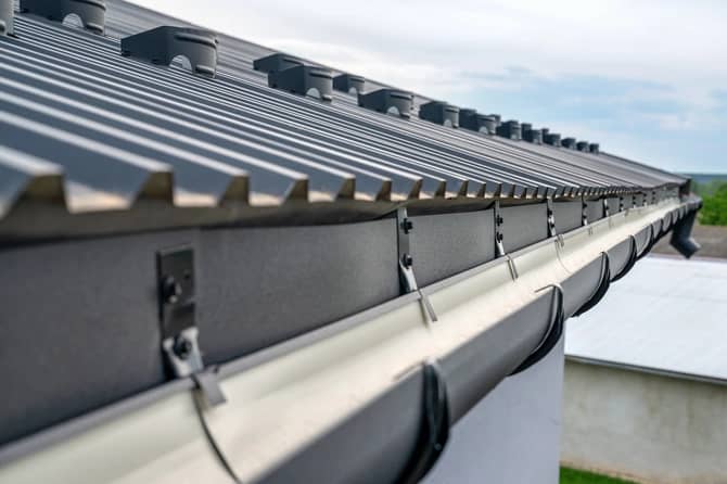 gutter system on the metal roof of house