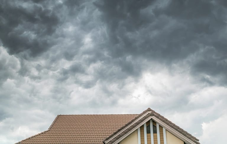 before storm dark clouds over the house