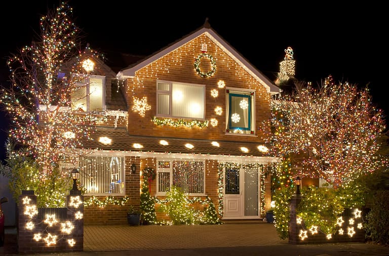 beautiful home at night light up with Christmas lights