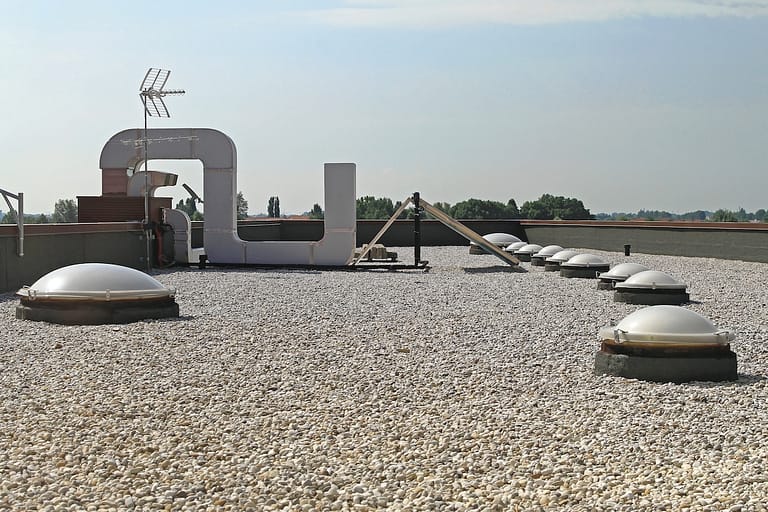Flat Roof With Gravel and Skylight Windoows