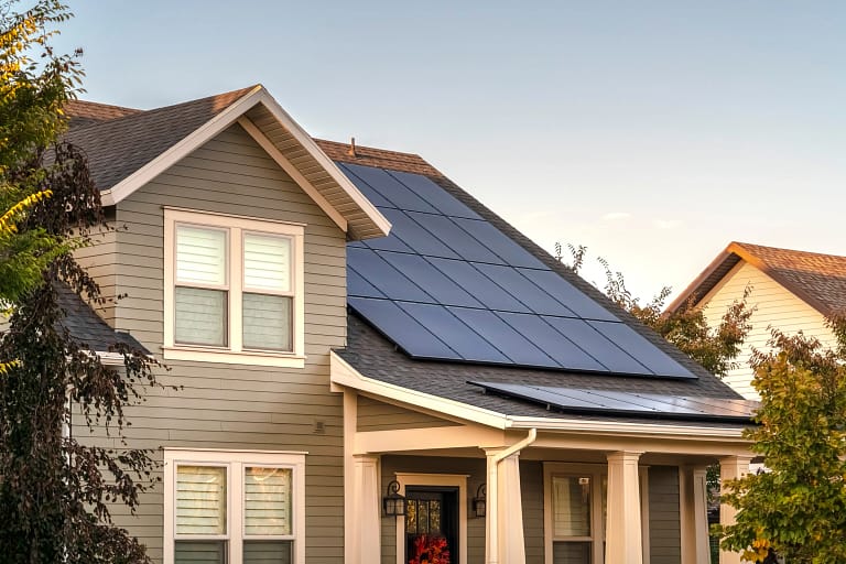 House with solar panels which benefits the environment and saves you money