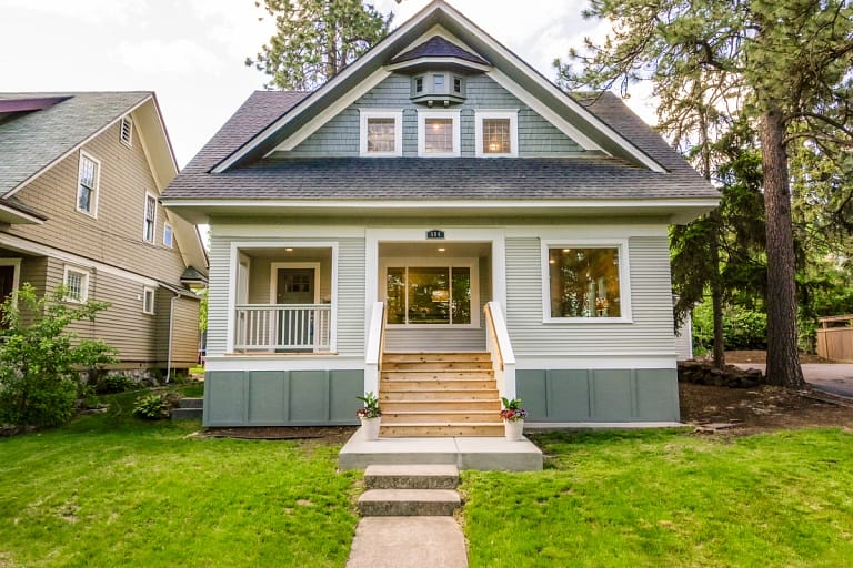 A cute house with asphalt shingle roof