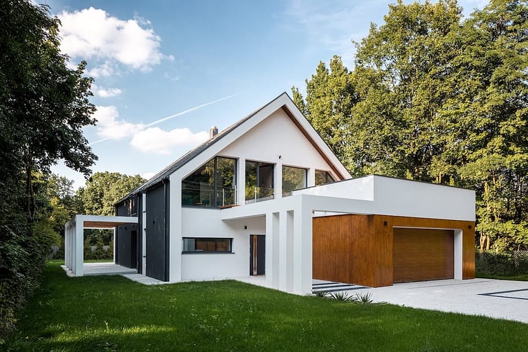Exterior view of modern, white house with garage