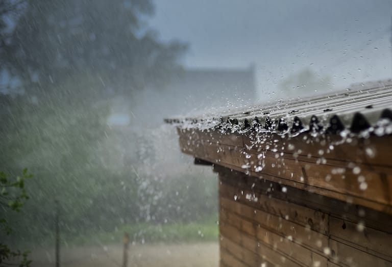 rain flows down from a roof down