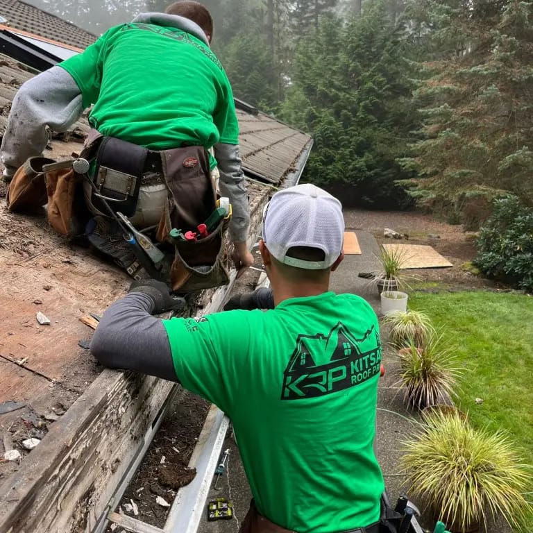 kitsap roof pro employees working on a roof